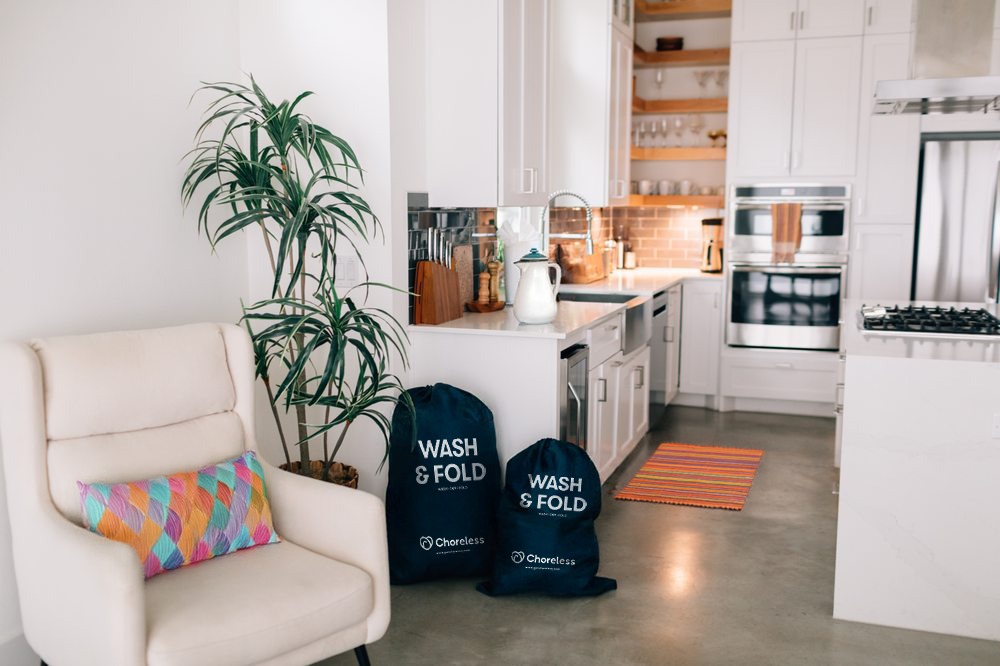 Neatly organized closet, with clothes hung and folded